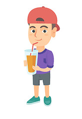 Image showing Boy drinking orange juice through a straw.