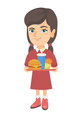 Image showing Little caucasian girl holding tray with fast food.
