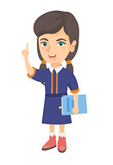 Image showing Little caucasian schoolgirl pointing forefinger up