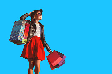 Image showing The girl walking with shopping bags