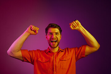 Image showing Winning success man happy ecstatic celebrating being a winner. Dynamic energetic image of male model