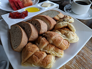 Image showing Cup of tasty coffee with tasty breads