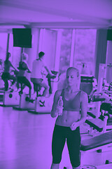 Image showing woman in fitness gym drink water