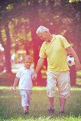 Image showing happy grandfather and child in park