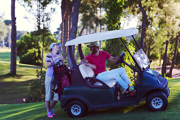 Image showing couple in buggy on golf course