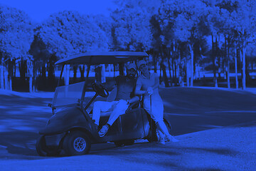 Image showing couple in buggy on golf course