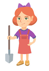 Image showing Caucasian smiling girl holding a shovel.