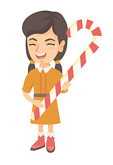 Image showing Caucasian little girl holding christmas candy cane