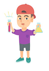 Image showing Little caucasian boy holding test tube and beaker.