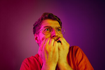 Image showing Portrait of the scared man on pink