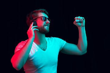 Image showing Enjoying his favorite music.