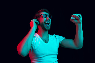 Image showing Enjoying his favorite music.