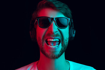 Image showing Enjoying his favorite music.