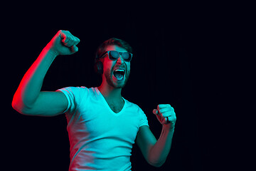 Image showing Enjoying his favorite music.