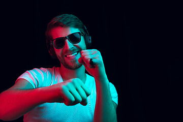 Image showing Enjoying his favorite music.