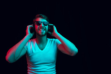 Image showing Enjoying his favorite music.