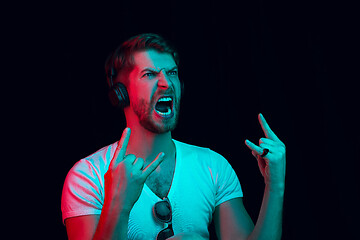 Image showing Enjoying his favorite music.