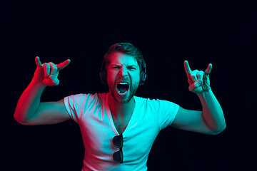 Image showing Enjoying his favorite music.