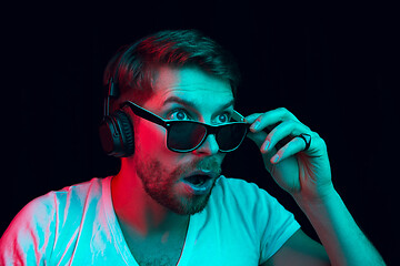 Image showing Enjoying his favorite music.