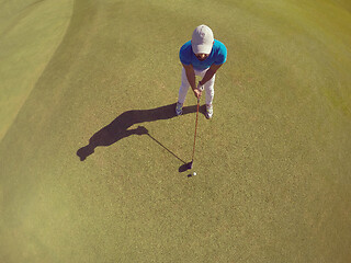 Image showing top view of golf player hitting shot