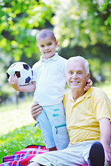 Image showing happy grandfather and child in park