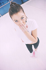 Image showing happy diet concept with young woman on pink scale