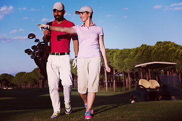 Image showing couple walking on golf course