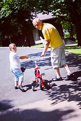 Image showing grandfather and child have fun  in park