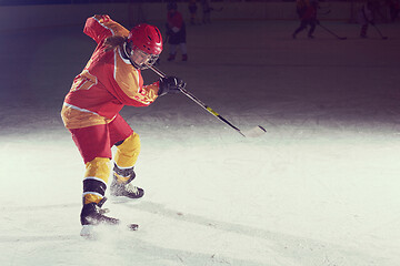 Image showing teen ice hockey player in action