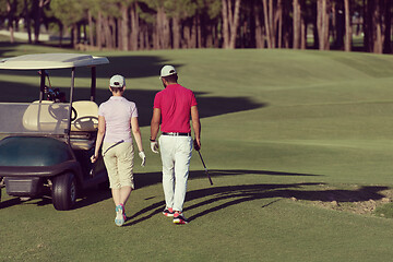 Image showing couple walking on golf course