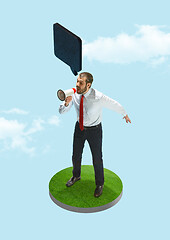 Image showing Business man screaming with a megaphone on blue sky background