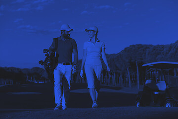 Image showing couple walking on golf course