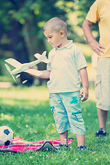 Image showing grandfather and child have fun  in park