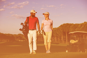 Image showing couple walking on golf course