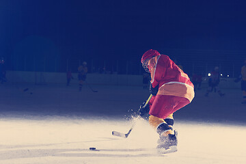 Image showing teen ice hockey player in action