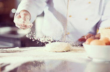 Image showing chef hands preparing dough for pizza