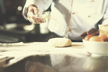 Image showing chef hands preparing dough for pizza