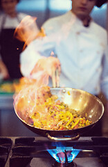 Image showing Chef doing flambe on food