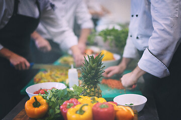 Image showing team cooks and chefs preparing meals