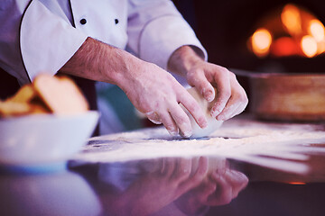 Image showing chef hands preparing dough for pizza