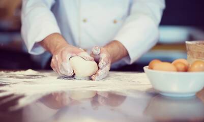 Image showing chef hands preparing dough for pizza