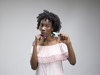 Image showing young woman looking on pregnancy test