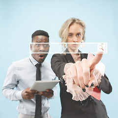 Image showing Woman\'s hand with finger on blue background