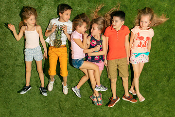 Image showing Group of happy children playing outdoors.