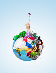 Image showing A globe of the earth with trash over white background, the concept of ecology problem