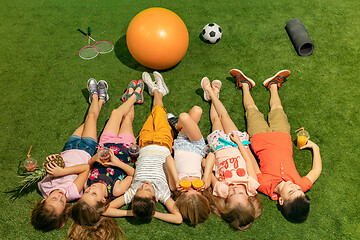 Image showing Group of happy children playing outdoors.