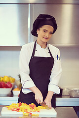 Image showing Chef cutting fresh and delicious vegetables