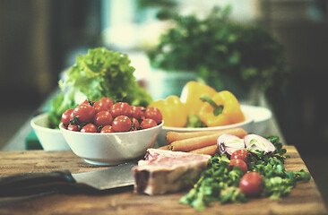 Image showing Juicy slice of raw steak on wooden table