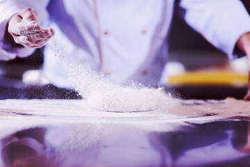 Image showing chef hands preparing dough for pizza