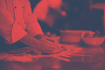 Image showing chef hands preparing dough for pizza